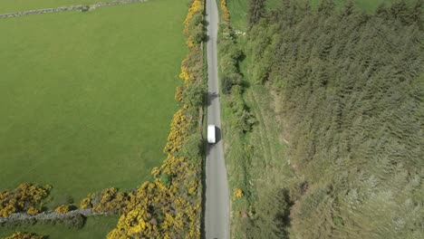 courier delivery van commuting at wicklow mountains ireland aerial