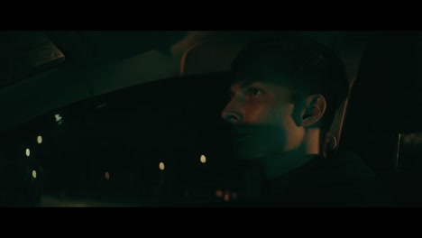 man driving at night