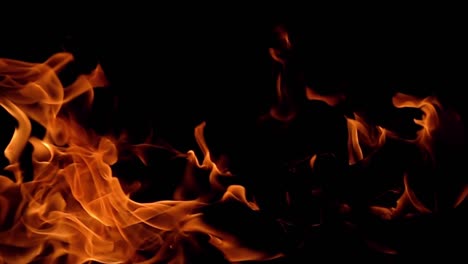 flames of fire on black background in slow motion