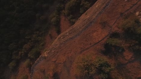 aerial view of a cliff face and surrounding landscape