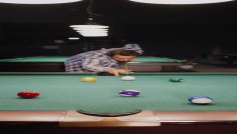 man playing pool