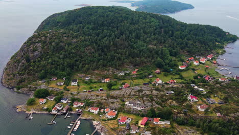 small village by the mountainside in brattön, sweden - aerial shot