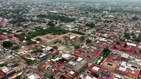 drone: high altitude drone shot tilt down of santo domingo chapel at oaxaca