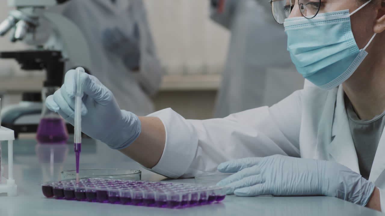Female Scientist Doing Experiment in Lab