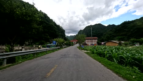 pov of scooter traveling the ha giang loop road in vietnam