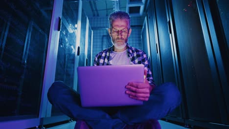technician working in a data center at night