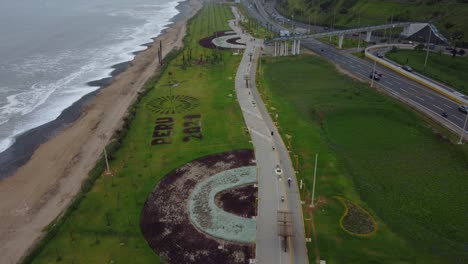 Green-grassy-park-with-a-long-walkway-for-walking-and-bicycles