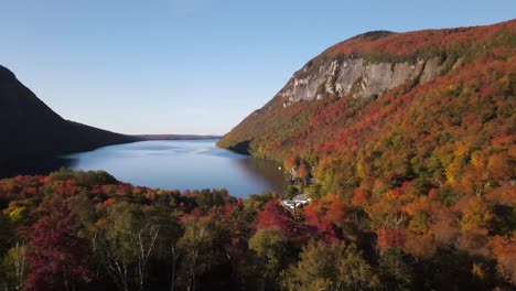 Beautiful-aerial-drone-footage-of-the-fall-leaves-on-and-around-Mount-Hor,-Mount-Pisgah,-and-Lake-Willoughby-during-peak-autumn-foliage-at-Willoughby-State-forest-in-Westmore,-Vermont