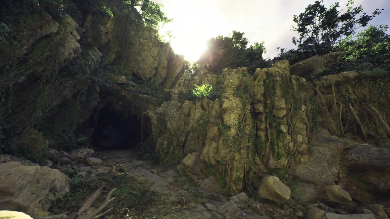 Secluded cave entry nestled beneath imposing cliffs and rugged landscape