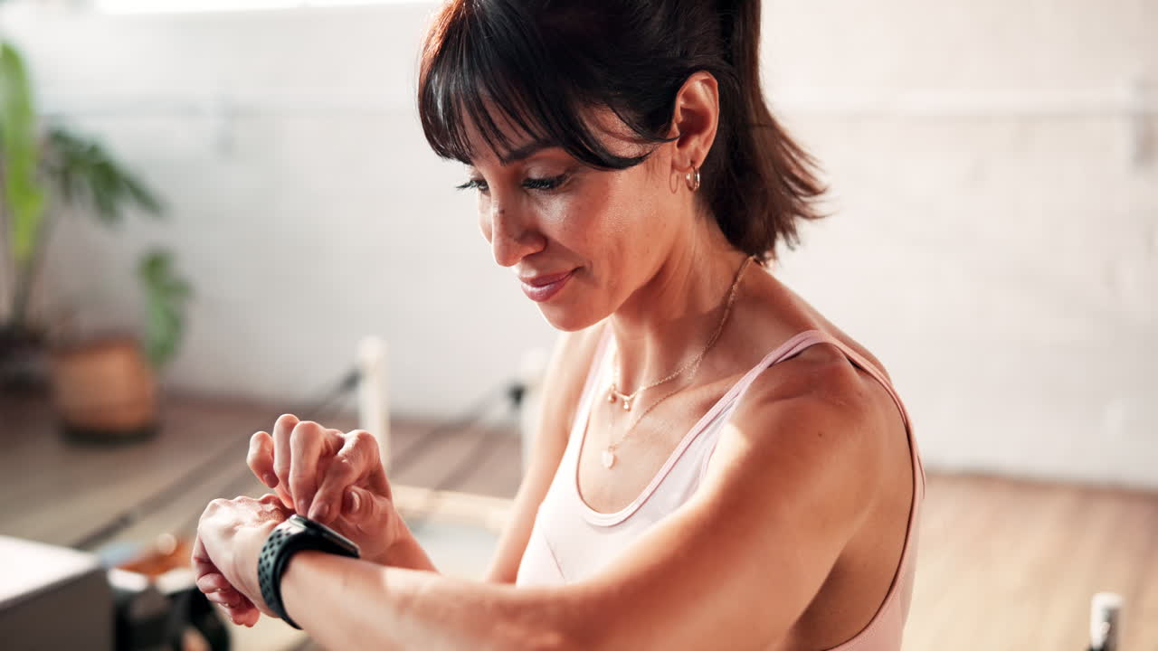 Woman checking her fitness tracker after a workout