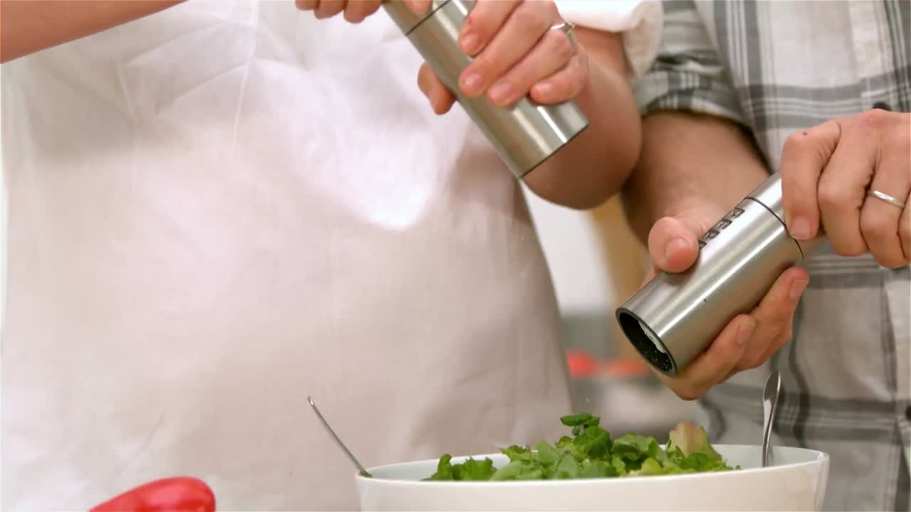Couple preparing salad