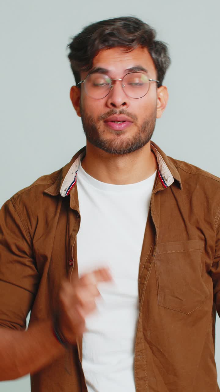 Exhausted tired indian man takes off glasses rubbing eyes feels pain sleepy exhausted overwork