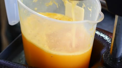 fresh orange juice being prepared