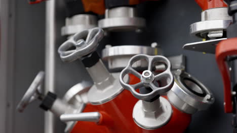 close-up of fire hoses and valves on an emergency vehicle