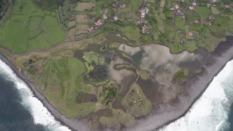 Drone-view-over-Fajã-dos-Cubres,-scenic-wildlife-park-and-tidal-lagoon