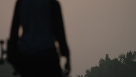 a skateboarder skating at sunset