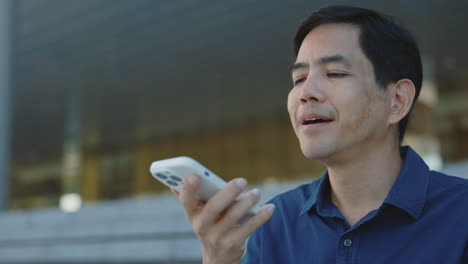 man using a smartphone voice assistant