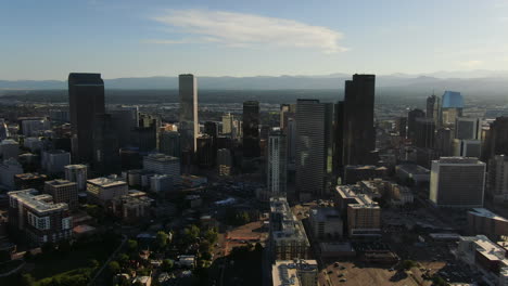 wide drone panning shot of high modern buildings in the center of denver