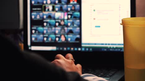 Close-up-shot-of-woman-with-veil-in-group-zoom-meeting,slow-motion