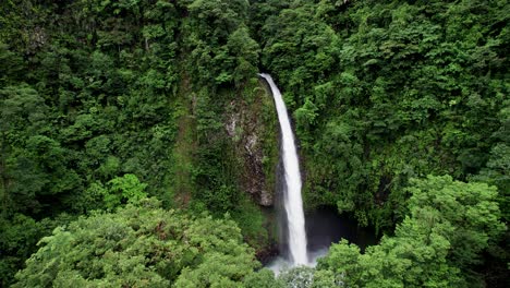 roaring la fortuna waterfall in tropical jungle valley in costa rica