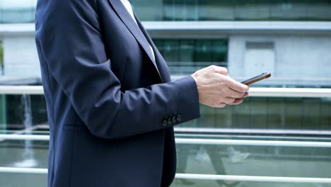 cropped shot of businesswoman using smartphone