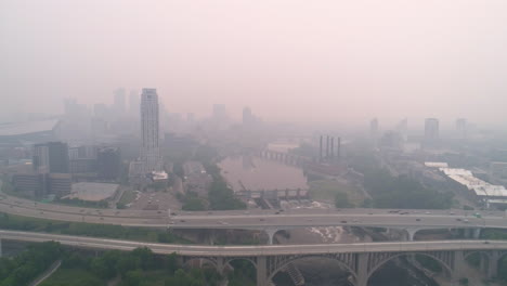 ariel over minneapolis interstate 35w with downtown obscured by wildfire smoke