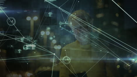network of connections and data processing animation over person using smartphone