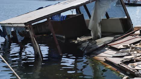 sunken wooden boat in water