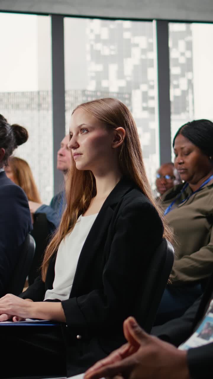 Vertical Video Young female adult attending international business summit for the press