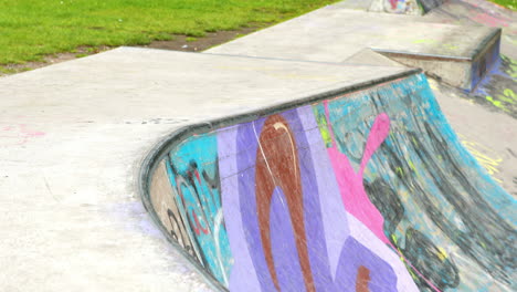 Young-skateboarder-skating-the-outdoor-skatepark