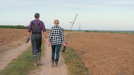 farmers planting trees in a field