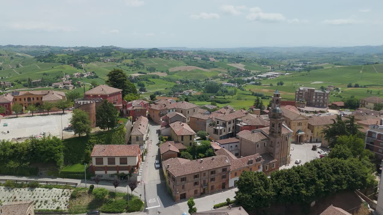 Agliano Terme, Asti, Piedmont, Italy. 4k aerial view of the town. Langhe-Roero and Monferrato. Flying forward above the town with the church of San Giacomo Maggiore on the right