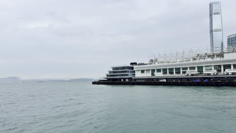 footage captured from a ferry in hong kong, showcasing the city skyline, bustling harbor, moving vessels, and waterfront activity, highlighting the dynamic energy and scenic beauty of victoria harbour