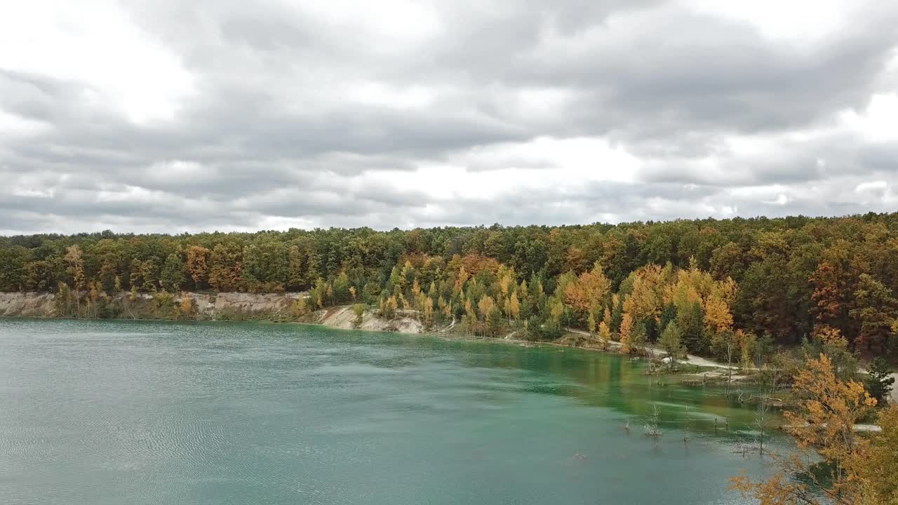 Forest lake landscape. Aerial view with drone of green forest and lake
