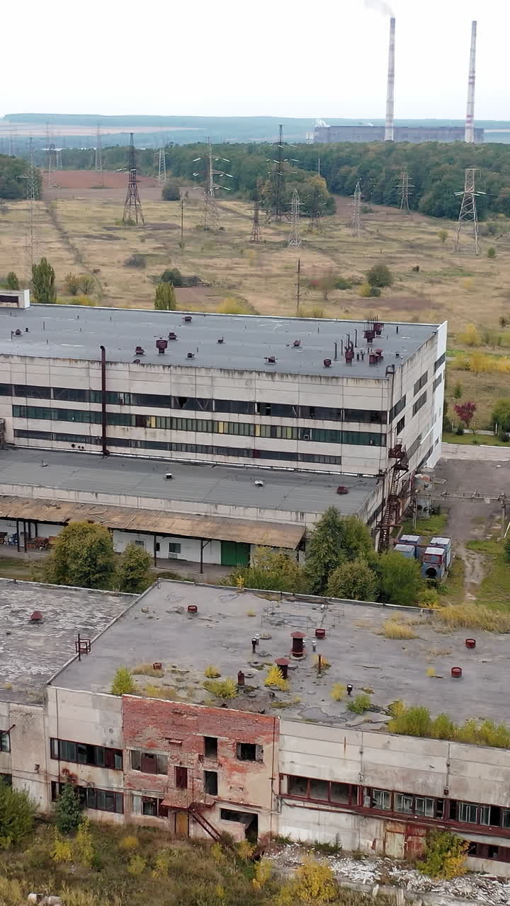Cement industrial factory building equipment. Big factory buildings drone view. Vertical video