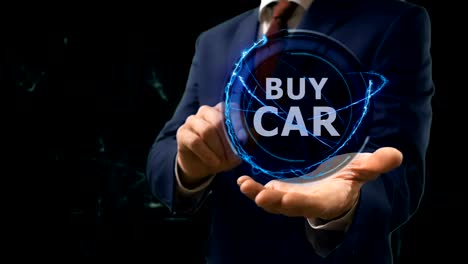 businessman shows concept hologram buy car on his hand