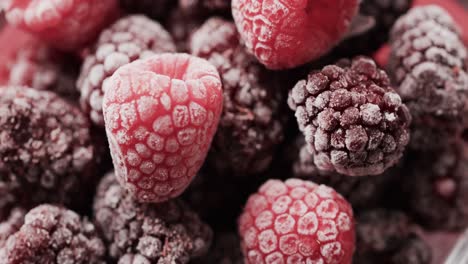 micro video of close up of raspberries with copy space