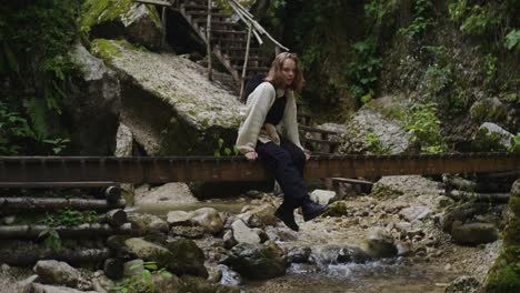 woman hiking in a forest creek