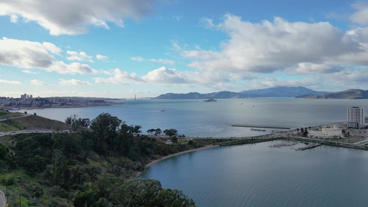 A smooth horizontal drone push-in towards Treasure Isle Marina at Yerba Buena Island, CA. Captures the marina, boats, and scenic waterfront. Perfect for coastal, travel, or marine-themed footage.