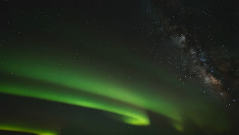 vibrant aurora borealis and milky way in the night sky