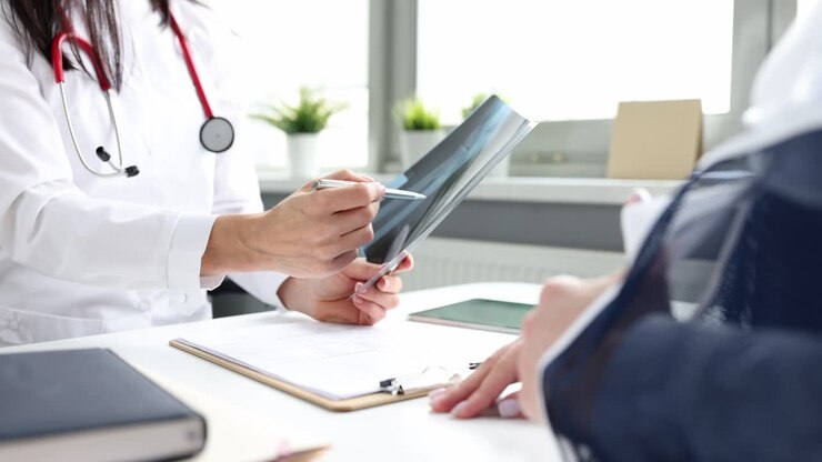 Doctor explaining X-ray to a patient