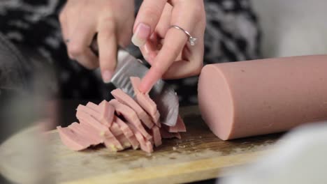 Chopping-circular-beef-hotdog-slowly-meat-closeup