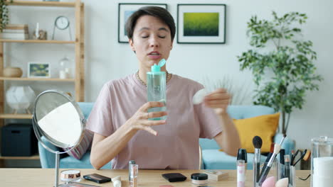 woman demonstrating makeup cleansing routine