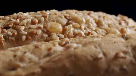 spinning bread baguette on black background