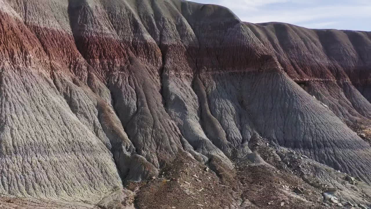 Drone footage of the scenic colorful, layered brown rocks formations in badlands. Arizona, USA