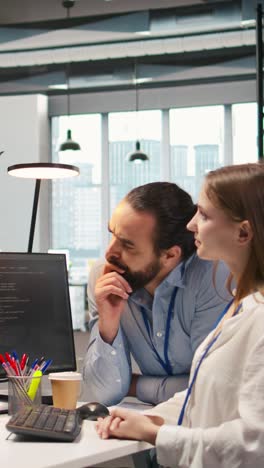 vertical video teamworking programmers developing software applications, working together