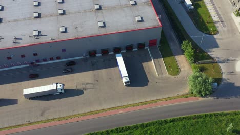 aerial view of warehouse with trucks