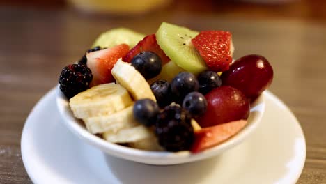 Fruit-Bowl-with-Banana,-Blueberries,-Grapes,-Kiwi,-Strawberry,-Blackberries,-Close-Up