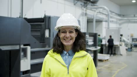 smiling female technician looking at camera