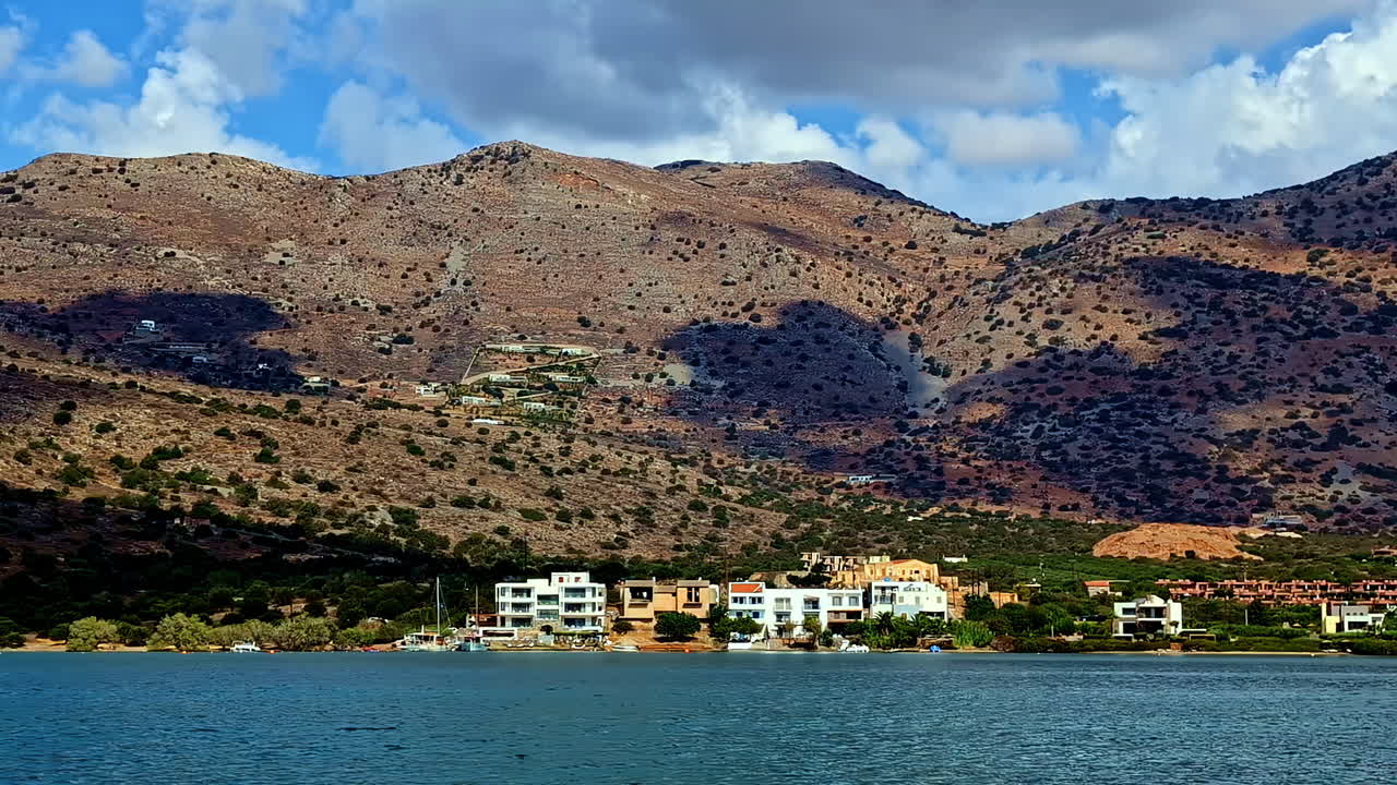 Houses on the hillside overlooking the sea in Greece